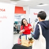 A student interacting with the Sustainable Seneca booth at the Sustainability Career Fair at Seneca Polytechnic, where they discovered career opportunities across diverse sectors, including banking, landscape, community work, and green energy.