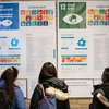 Students read up on global implementation of the Sustainable Development Goals at an exhibit in Carnegie Mellon's Cohon University Center