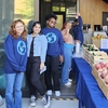 Students pose for picture at a Free Food Market