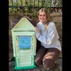 Lily Pavliscsak next to the free book exchange