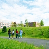 UMass Boston students walk through the new quad, designed with innovative green infrastructure and sustainability features