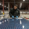 Keith Rich assembles solar panels at Crossroads Solar in South Bend.