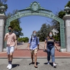 Students at the Iconic UC Berkeley Sather Gate, with masks